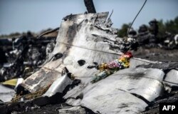 A piece of the Malaysia Airlines plane MH17 near Hrabove in the Donetsk region, Ukraine, July 26, 2014.