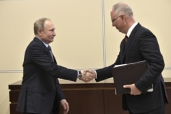 RUSSIA -- Russian President Vladimir Putin, left, meets with Kirill Dmitriyev, head of the Russian Direct Investment Fund, at the Novo-Ogaryovo residence outside Moscow, January 17, 2020.
