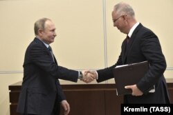 RUSSIA -- Russian President Vladimir Putin, left, meets with Kirill Dmitriyev, head of the Russian Direct Investment Fund, at the Novo-Ogaryovo residence outside Moscow, January 17, 2020.