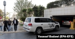 SYRIA -- UN vehicles carrying Fact-Finding Mission (FFM) team of the Organization for the Prohibition of Chemical Weapons (OPCW) arrive at the Four Seasons hotel in Damascus, April 14, 2018