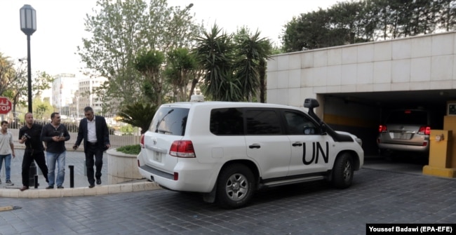 SYRIA -- UN vehicles carrying Fact-Finding Mission (FFM) team of the Organization for the Prohibition of Chemical Weapons (OPCW) arrive at the Four Seasons hotel in Damascus, April 14, 2018