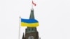 The Ukrainian flag is seen in front of the Peace Tower on Parliament Hill after Ukraine's President Volodymyr Zelensky addressed Canada's parliament in Ottawa, Ontario, Canada, March 15, 2022. (Patrick Doyle/Reuters)