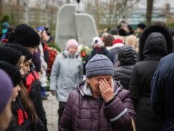 RUSSIA -- A woman cries at an opening ceremony of a monument commemorating victims of the crash of Metrojet Airbus A321 in Egypt's Sinai peninsula in 2015, in St. Petersburg, Russia October 28, 2017