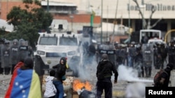  Demonstrators clash with police during a protest against Venezuelan President Nicolas Maduro's government in Caracas, Venezuela January 23, 2019. REUTERS/Manaure Quintero/File Photo