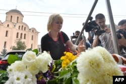 UKRAINE -- People lay flowers and light candles at Dutch embassy in Kiev on July 17, 2018, to remember those killed on flight MH17 four years ago when the plane was shot down over war-torn Ukraine.