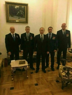 Russia --Vladimir Putin (C) with the members of the PMC Wagner in the Kremlin, Moscow.