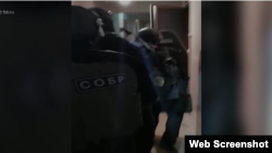 Video provided by Russia's Federal Security Service shows one of the raids on alleged right-wing terrorists in nine different Russian cities.