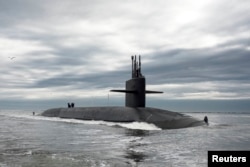The Ohio-class ballistic missile submarine USS Tennessee returns to Naval Submarine Base Kings Bay, Georgia, February 6, 2013. The Tennessee and 13 other Ohio-class submarines are critical elements of the U.S. nuclear deterrent, but the oldest has been in