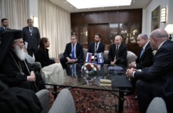 ISRAEL -- Russian President Vladimir Putin, Israeli Prime Minister Benjamin Netanyahu, Yaffa Issachar, mother of Naama Issachar who is jailed in Russia on drug charges, and officials attend a meeting in Jerusalem, January 23, 2020