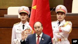 Vietnam's newly elected President Nguyen Xuan Phuc takes an oath in front of the National Assembly in Hanoi on April 5.