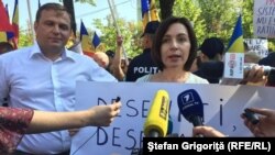 Moldova - Chisinau, protest 'against' and 'in favor' change electoral system. Maia Sandu and Andrei Nastase, two leaders of the opposition parties