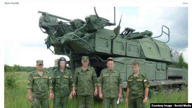 RUSSIA-Russian officers with BUK missile launcher from bellingcat investigation.