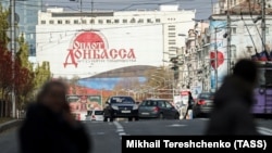 UKRAINE -- An election campaign billboard in eastern Ukraine held by Russia-backed separatists is seen on a street in Donetsk, November 5, 2018.