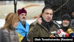 UKRAINE -- Former Georgian President Mikheil Saakashvili, accompanied by his wife Sandra Roelofs, addresses his supporters in front of the Parliament building in Kyiv, December 6, 2017