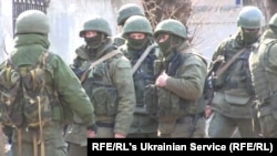 Russian soldiers without insignia on their green uniforms seized control of Crimea in 2014.