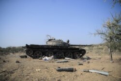Ammunition is seen next to a tank destroyed in a fight between the Ethiopian National Defence Force (ENDF) and the Tigray People's Liberation Front (TPLF) forces in Kasagita town, Afar region, on February 25, 2022. (Tiksa Negeri/Reuters)