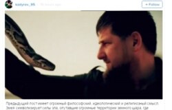 Chechen leader Ramzan Kadyrov (right) grapples with a snake in a screen grab from a video he posted on Instagram.