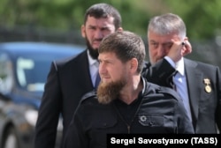 Ramzan Kadyrov (front), Chechen Parliament Chairman Magomed Daudov (L), and State Duma member Adam Delimkhanov (R) arrive for the inauguration of Vladimir Putin as President of Russia on May 7, 2018.