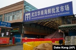 The Wuhan Huanan Wholesale Seafood Market, where a number of people fell ill with COVID-19 at the onset of the pandemic, sits closed in Wuhan on Jan, 21, 2020.