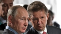 Russian President Vladimir Putin, left, and Alexei Miller, Russian natural gas giant Gazprom CEO, attend a meeting in Novobureyskiy, Russia, on Aug. 3, 2017. (Alexei Nikolsky/Pool Photo via AP)