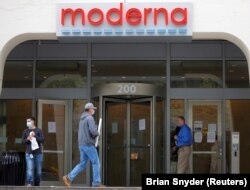 FILE PHOTO: A sign marks the headquarters of Moderna Therapeutics, which is developing a vaccine against COVID-19, in Cambridge, Massachusetts, U.S., May 18, 2020.