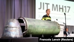 NETHERLANDS – A part of the BUK-TELAR rocket that was fired on the MH17 flight is displayed on a table during the persconference of the Joint Investigation Team, in Bunnik on May 24, 2018