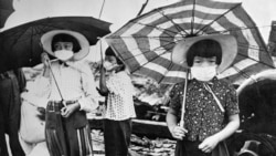 Picture dated 1948 showing children wearing masks to protect themselves from radiation in the devastated city of Hiroshima after the U.S. nuclear bombing on the city on August 6, 1945, during World War II. (STF/AFP)