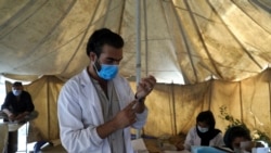 A doctor fills a syringe with the Johnson & Johnson COVID-19 vaccine at a vaccination center in Kabul, Afghanistan, Sunday, July 11, 2021. The COVID-19 vaccines were donated by the United States and delivered through the U.N. (Rahmat Gul/AP)