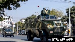 MYANMAR - Military vehicles are seen along a street in Mandalay on February 2, 2021, as Myanmar's generals appeared in firm control a day after a surgical coup that saw leader Aung San Suu Kyi detained.