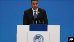 Jamaica's Prime Minister Andrew Holness delivers a speech at the opening ceremony of the China International Import Expo in Shanghai on Tuesday, Nov. 5, 2019.