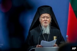 Ecumenical Patriarch of Constantinople Bartholomew I speaks during a news conference following his meeting with Lithuania's Prime Minister Ingrida Simonyte at the government's headquarters in Vilnius, Lithuania on March 21, 2023. (Mindaugas Kulbis/AP)