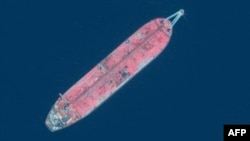 A satellite image obtained courtesy of Maxar Technologies shows a close up view of the FSO Safer oil tanker on June 19, 2020, off the port of Ras Isa.