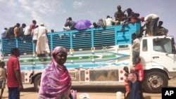 People board a truck as they leave Khartoum, Sudan, Monday, June 19, 2023. (AP Photo)