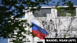 The Russian flag flies at the embassy's compound in Washington, D.C., on April 15, 2021. 