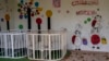 Empty cribs at a playhouse in the courtyard of Kherson regional children's home in Kherson, southern Ukraine, Friday, Nov. 25, 2022. (AP Photo/Bernat Armangue)