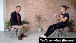 GERMANY -- Russian opposition politician Aleksey Navalny speaks during an interview with prominent Russian YouTube blogger Yury Dud, in Berlin, in this still image taken from a handout video released Oct. 6, 2020