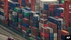 Shipping containers are seen at a port of Kwai Tsing Container Terminals in Hong Kong, Friday, Nov. 5, 2021 (AP/Kin Cheung)