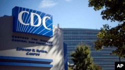 In this Oct. 8, 2013, file photo, a sign marks the entrance to the federal Centers for Disease Control and Prevention, in Atlanta. (AP Photo/David Goldman, File)