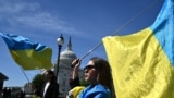 Activists wave Ukrainian flags outside the U.S. Capitol in Washington, DC, on April 23, 2024, ahead of a U.S. Senate vote on a foreign aid package which included $61 billion in assistance for Ukraine. (Mandel Ngan/AFP)