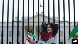 Demonstrators rally outside the White House to protest against the Iranian regime in Washington D.C., on October 22, 2022, following the death of Mahsa Amini. (Jose Luis Magana/AP)