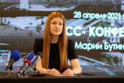 Member of the Russian Civic Chamber Maria Butina, who was jailed in the United States after admitting to working as a Russian agent, attends a news conference in Kirov on April 28, 2021. (Reuters)