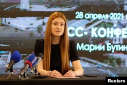 Member of the Russian Civic Chamber Maria Butina, who was jailed in the United States after admitting to working as a Russian agent, attends a news conference in Kirov on April 28, 2021. (Reuters)