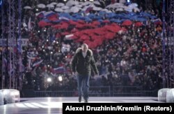 Russian President Vladimir Putin attends a concert marking the seventh anniversary of Russia's annexation of Crimea at Luzhniki Stadium in Moscow, Russia on March 18, 2021.